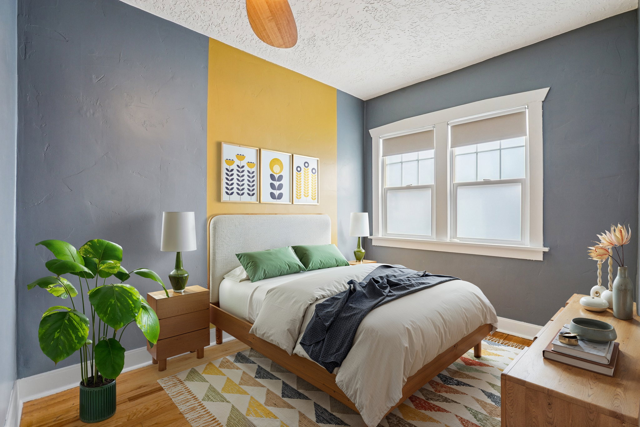 Bedroom featuring light wood finished floors, ceiling fan, and a textured ceiling