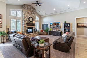 Kitchen featuring dark wood finish cabinetry, a kitchen bar, stainless steel appliances, and recessed lighting
