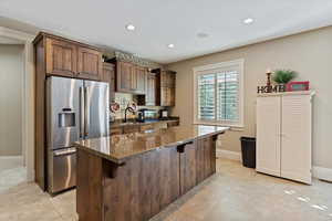 Living area featuring recessed lighting, a textured ceiling, light carpet, and a fireplace