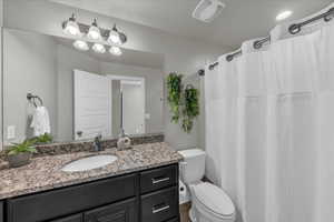 Bathroom with vanity and a shower with curtain
