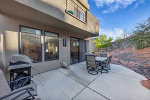 View of patio / terrace with outdoor dining space and a grill