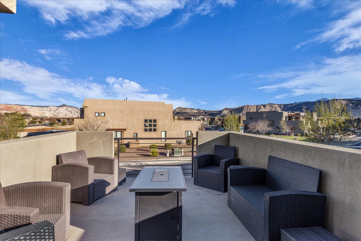 View of patio with outdoor seating, a mountain view, and a residential view