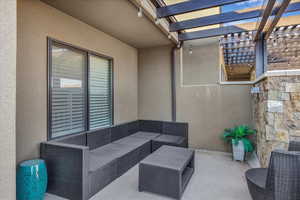 View of patio / terrace featuring outdoor furniture and a pergola