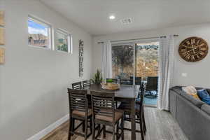 Dining space featuring light wood-type flooring and recessed lighting