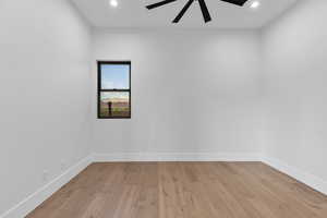 Empty room with light wood finished floors, recessed lighting, and a ceiling fan