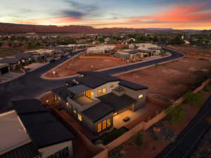 Aerial perspective of suburban area with a mountain backdrop