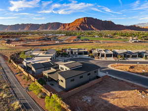 Aerial perspective of suburban area featuring a mountainous background