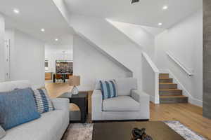 Living area featuring light wood-type flooring and recessed lighting