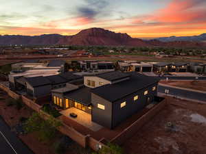 Aerial view at dusk of a residential view and a mountain view