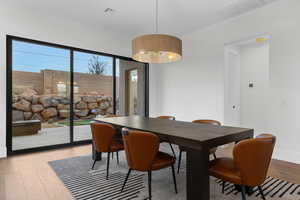 Dining room featuring light wood finished floors and baseboards