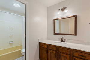 Bathroom featuring vanity and shower / bath combo