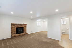 Unfurnished living room featuring carpet flooring and recessed lighting