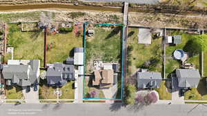 Aerial view of residential area featuring property boundaries highlighted