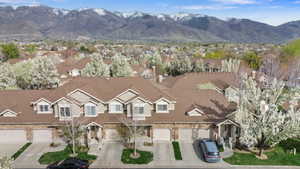 Aerial perspective of suburban area with a mountainous background
