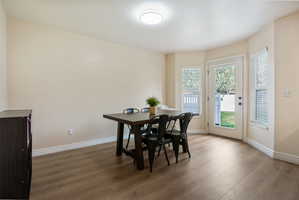 Dining room with baseboards and wood finished floors