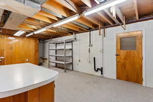 Large utility room/laundry room with basement walk out to the back yard