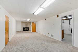 Basement den area with fireplace