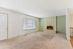 Unfurnished living room with gas fireplace