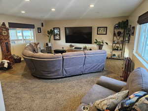 Living area featuring recessed lighting and carpet floors
