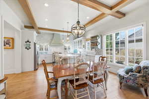 Dining space with quarter sawn white oak flooring, ceiling beams  and RH chandelier
