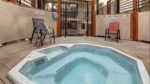 View of pool with a community hot tub