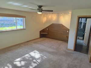 Bonus room featuring carpet floors and ceiling fan