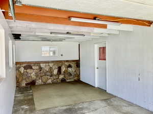 Garage featuring wooden walls
