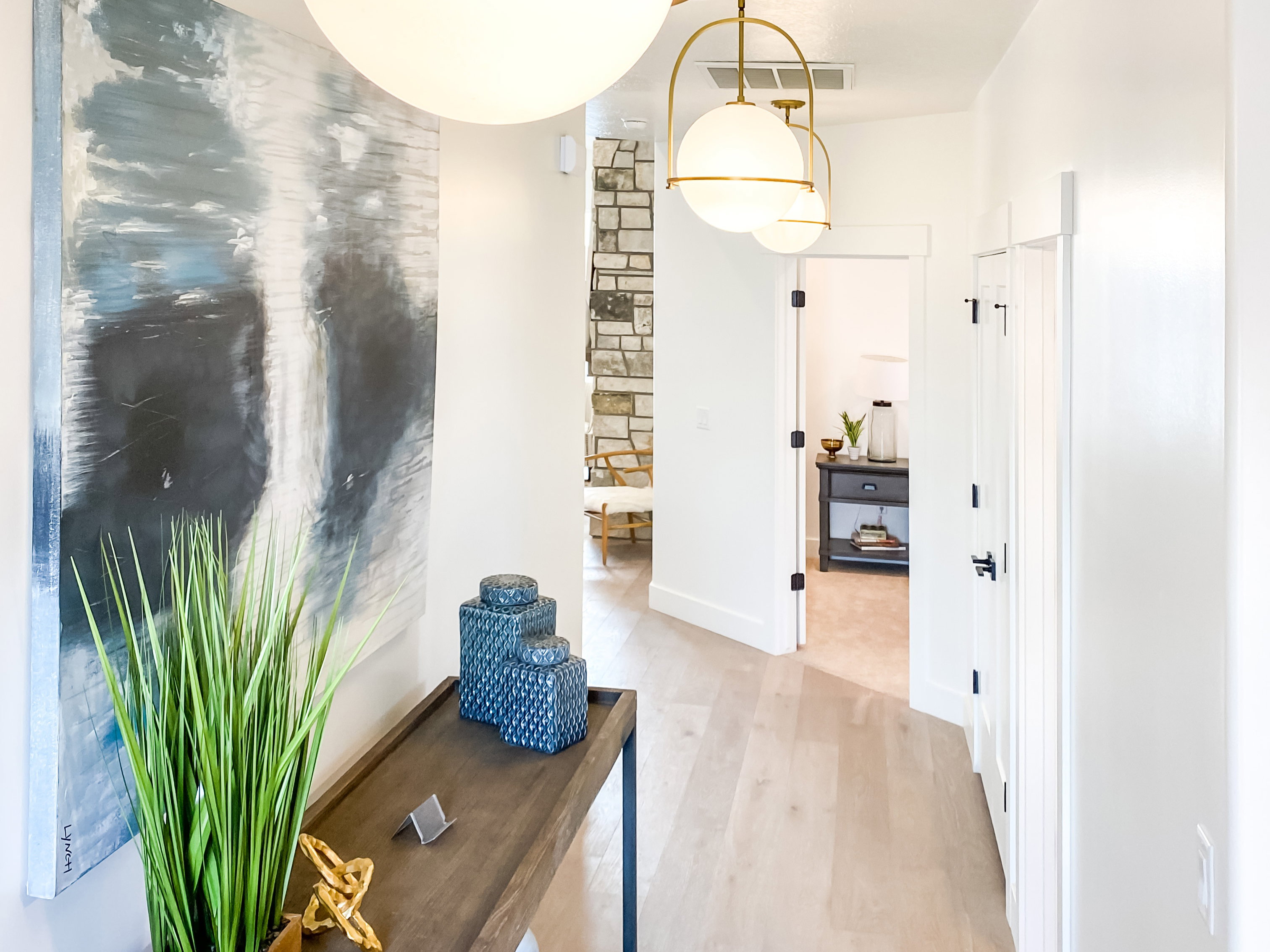 Hall featuring light wood-style floors and baseboards