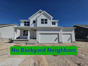 Modern farmhouse featuring board and batten siding and covered porch