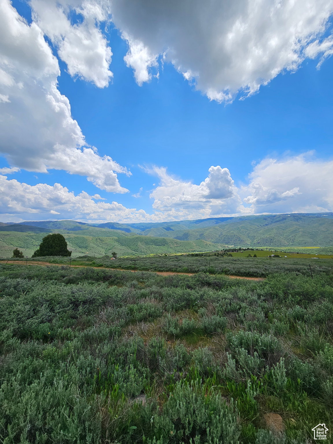 View of mountain background featuring rural landscape