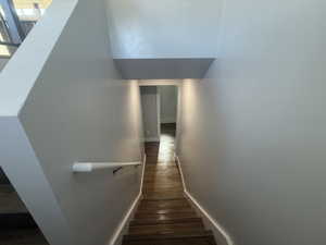 Stairs featuring wood-type flooring and baseboards
