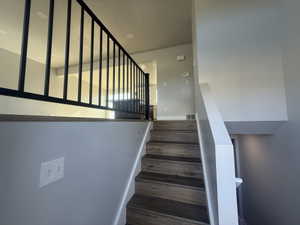Stairway with wood finished floors