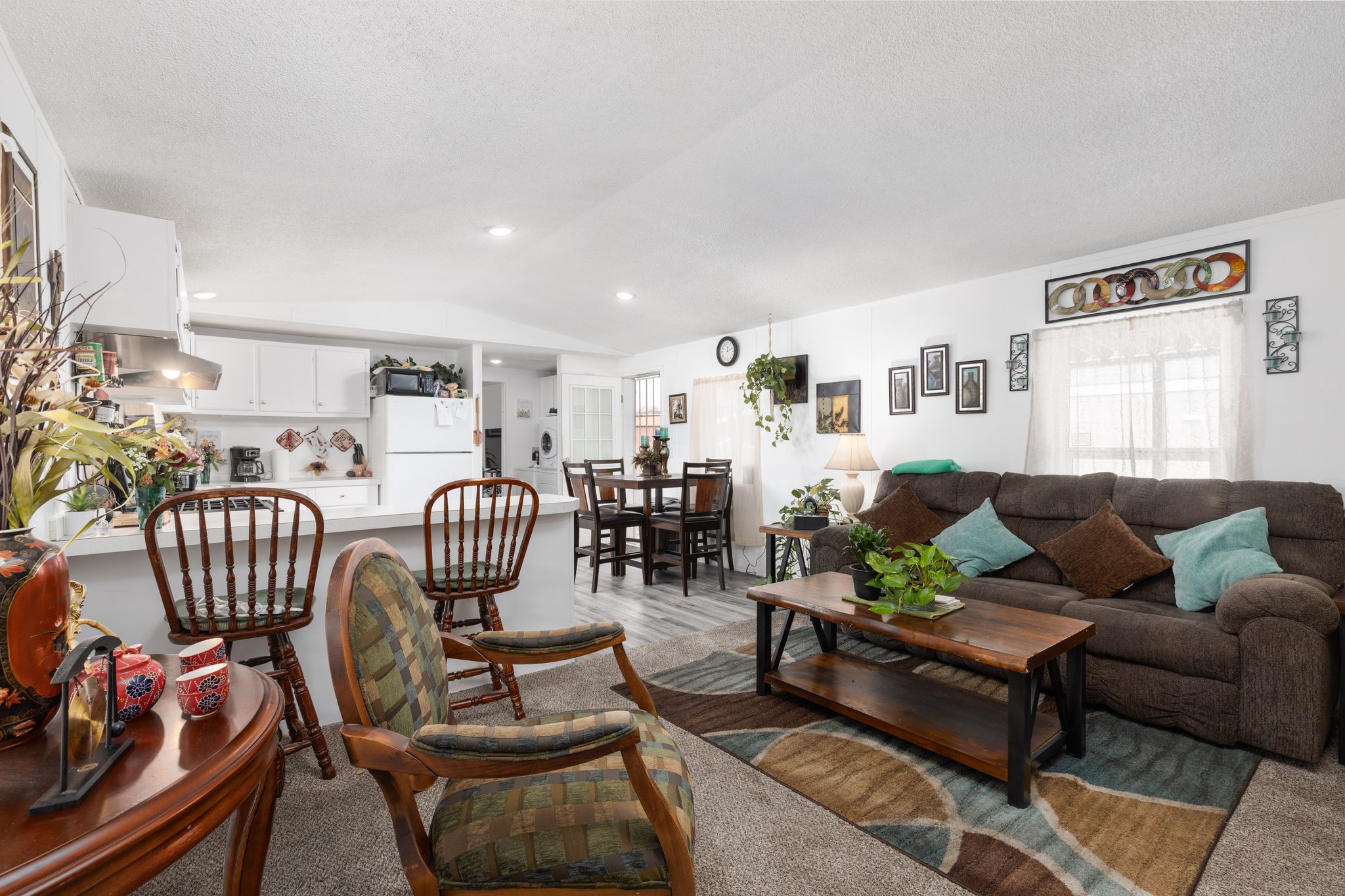 Living area featuring light wood finished floors and recessed lighting
