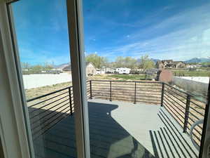 Wooden terrace with a residential view and a storage shed