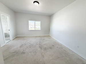 Unfurnished room with baseboards