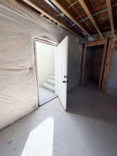 Unfinished basement with stairway