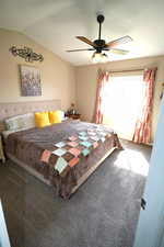 Bedroom with carpet, lofted ceiling, and ceiling fan