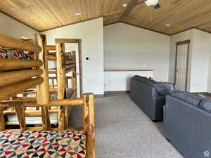 Living room with wooden ceiling, a ceiling fan, and recessed lighting