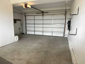 Garage featuring a garage door opener