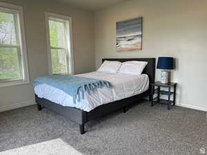 Carpeted bedroom with baseboards