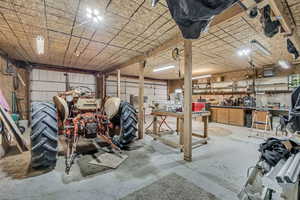 Garage with a workshop area and a heating unit