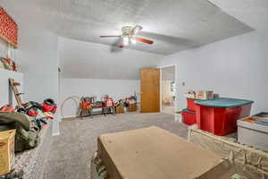Bedroom with carpet and ceiling fan