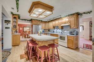 Kitchen featuring light countertops, light wood finished floors,