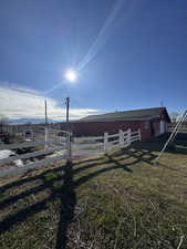View of yard with an outdoor structure