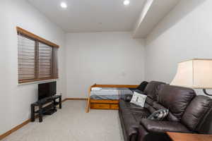 Bedroom featuring light colored carpet and recessed lighting