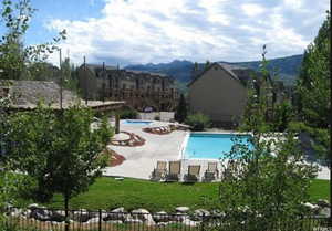 Community pool featuring a patio area and a mountain view