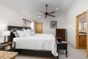 Bedroom with vaulted ceiling, light colored carpet, recessed lighting, and a ceiling fan