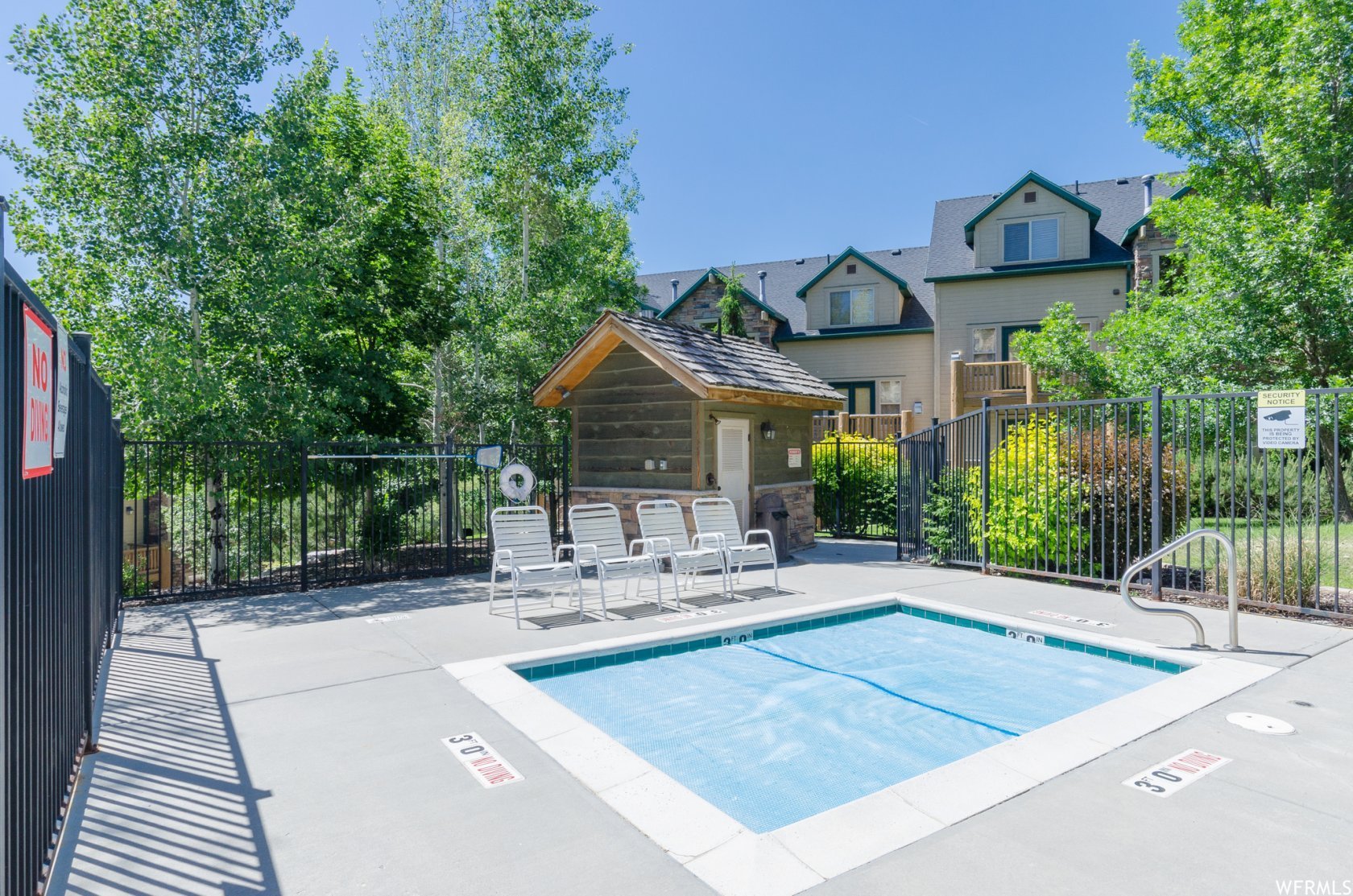 View of pool featuring a pool and patio surround