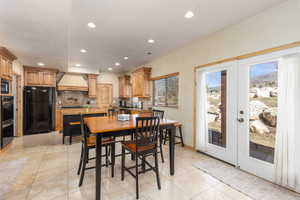Dining room featuring french doors, light tile patterned floors, and recessed lighting
