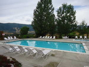 Community pool featuring a patio area and a mountain view